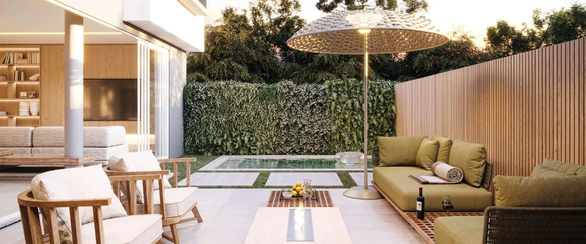 Varanda e jardim com piscina e mobiliário externo, planta A