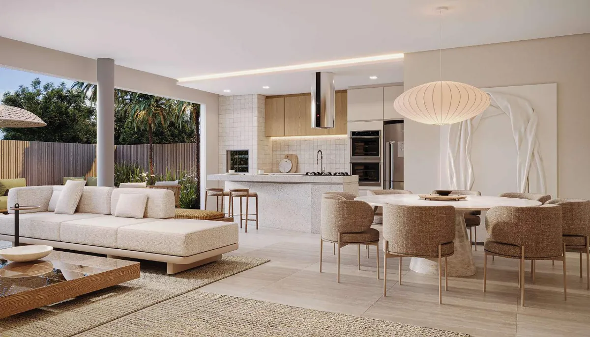 Sala integrada com cozinha e jardim em uma das casas do Atmos Ecoville