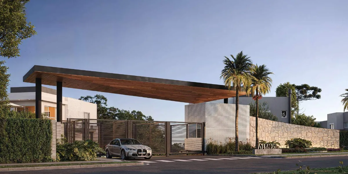 Portaria do Atmos Ecoville com cobertura em madeira e fechamento em pedra