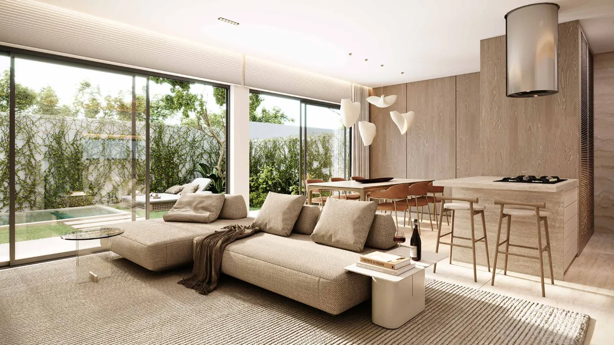 Living integrado com sofá, sala de jantar e cozinha, com ampla abertura de vidro para o jardim