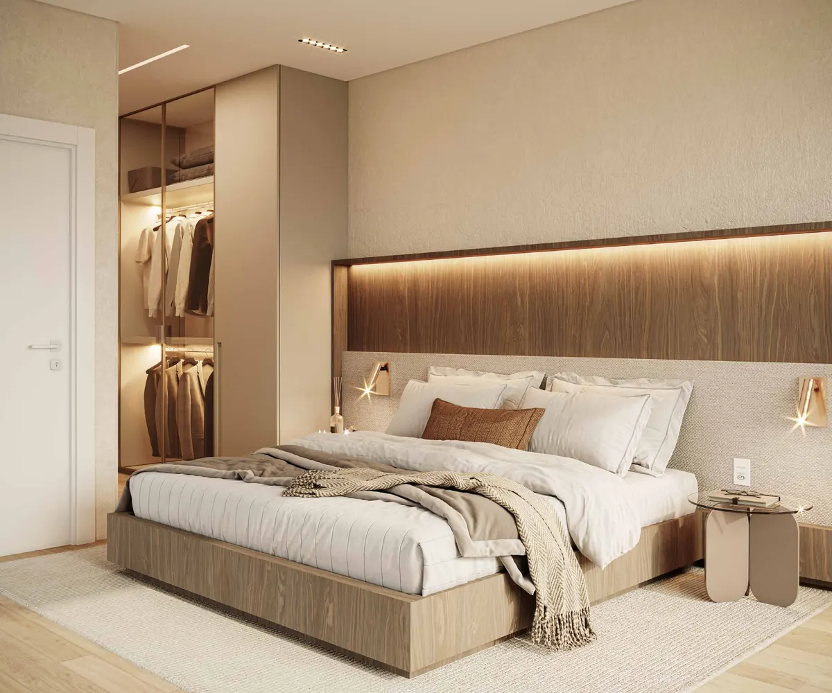 Suíte master com closet iluminado e painel de madeira na cabeceira