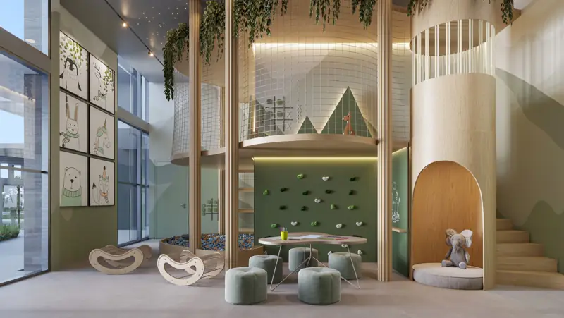 Brinquedoteca do Réve com parede de escalada, casa na árvore e mesa de atividades