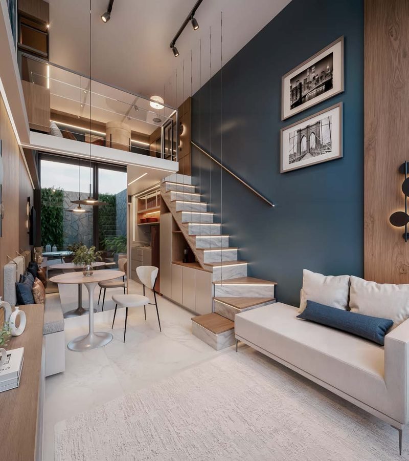 Loft duplex com escada iluminada, sala e mezanino