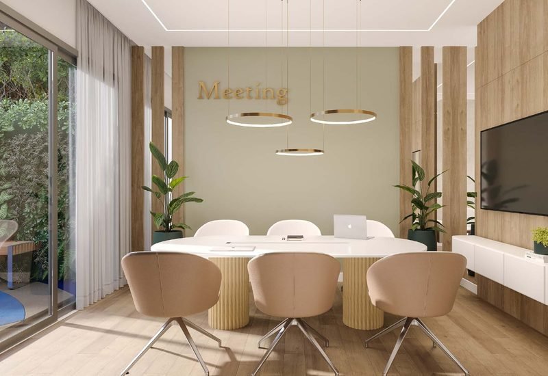 Sala de reuniões do Wave Lofts com mesa oval e poltronas