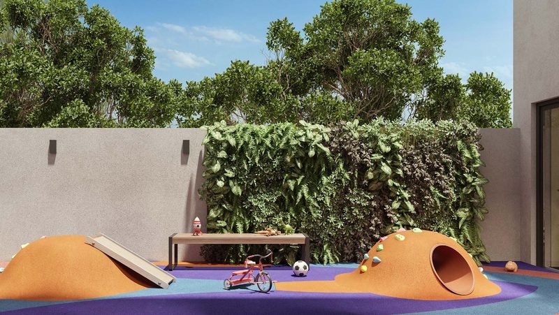 Playground com relevos coloridos e parede verde